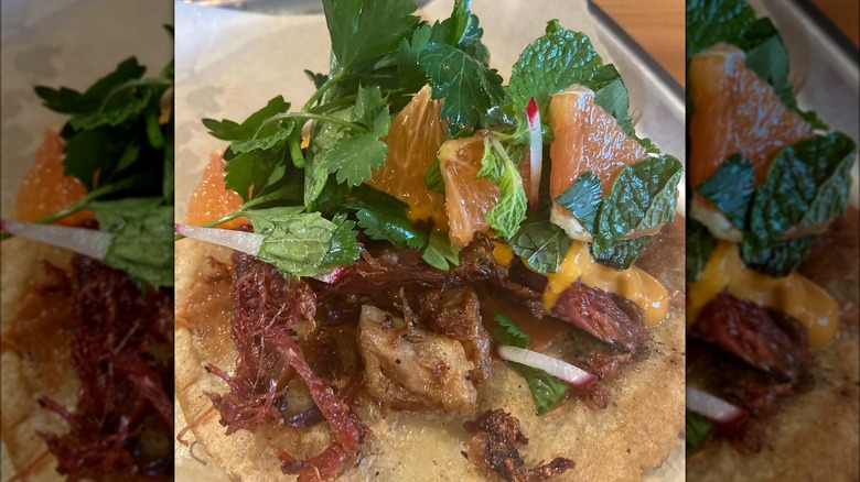 Duck carnitas taco on plate