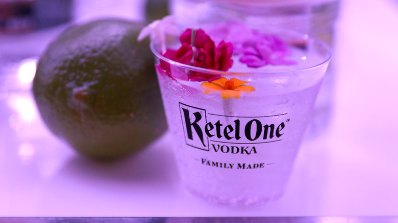 Glass of Ketel One Vodka with Flowers and Lime 