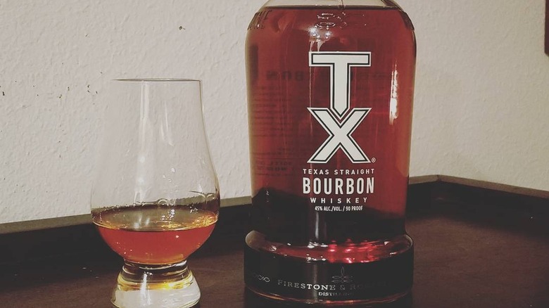 TX Straight Bourbon bottle with glass
