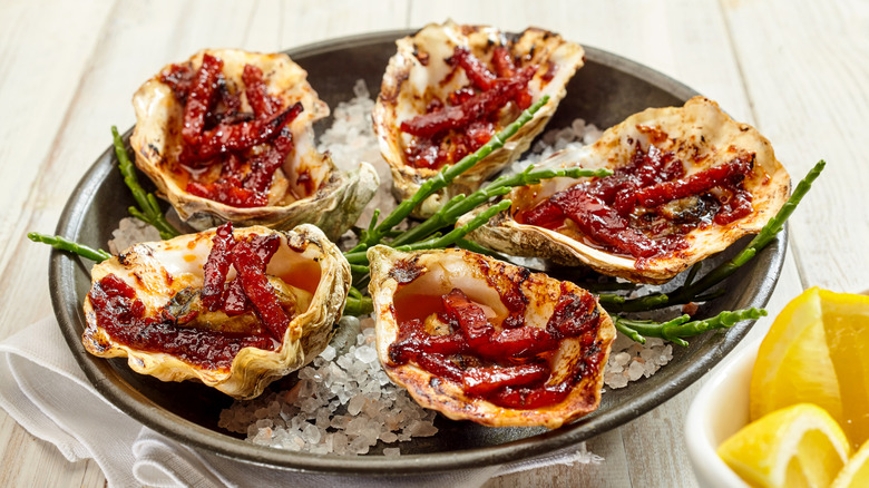 Oysters kilpatrick on plate