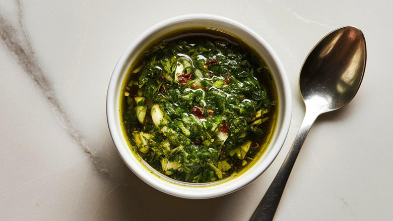 Chimichurri sauce in white bowl