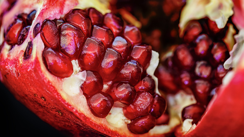 Close-up of red pomegranate seeds inside fruit