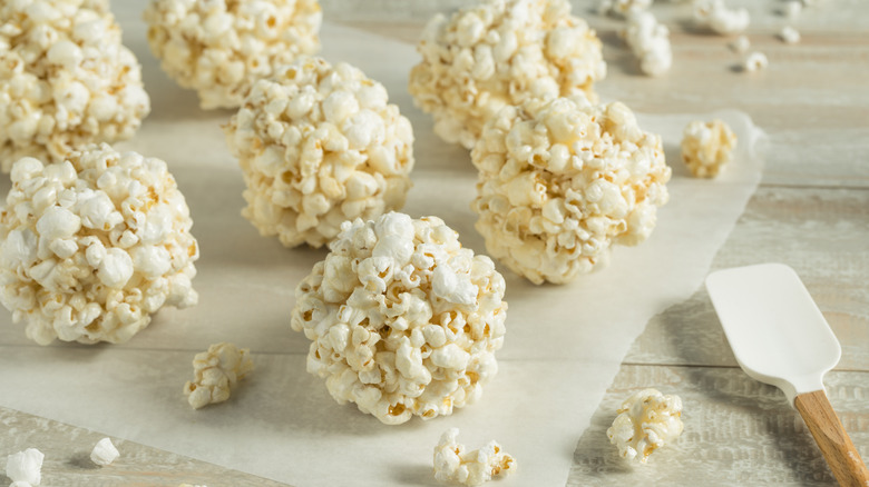 Balls of popcorn on a sheet of waxed paper