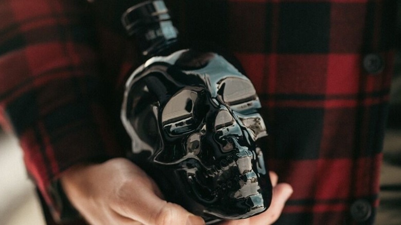 Hand holding Crystal Head Onyx