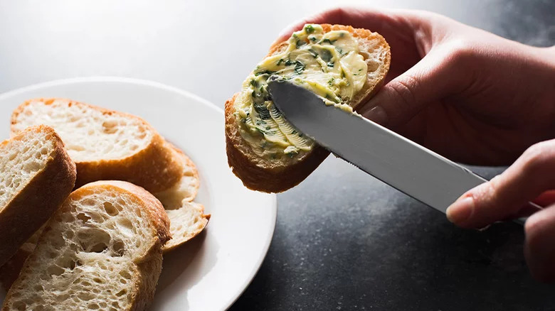 herb butter spread onto bread