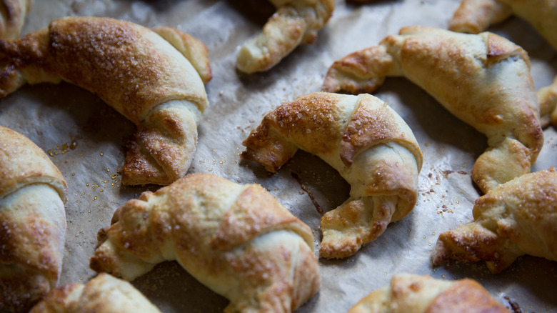 Mini croissants on baking sheet