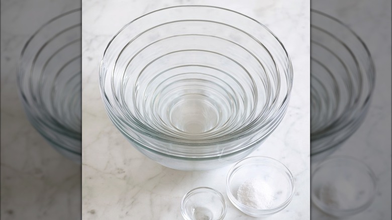 Glass mixing bowl set on marble surface