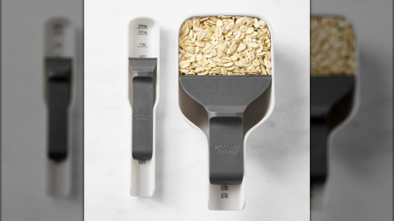 Measuring cup and spoon set on white background