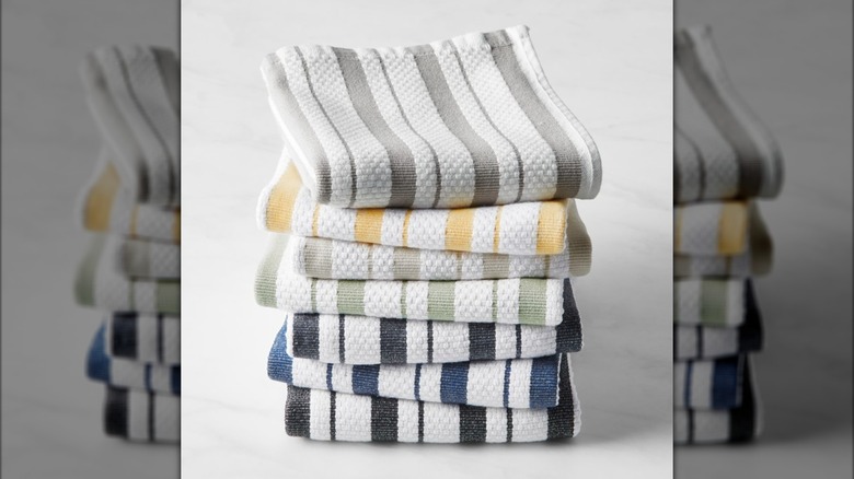 Kitchen towels in a stack on a marble surface