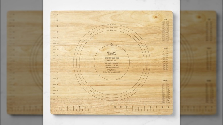 Wooden pastry board on white surface