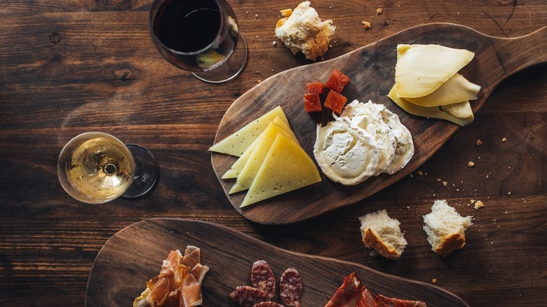 Paddle-shaped charcuterie board and wine glasses at Barcelona Wine Bar