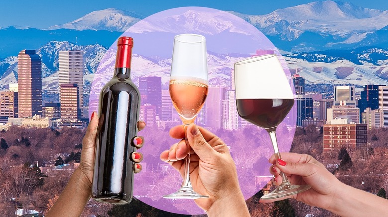 Wine bottle, champagne flute, and red wine glass against Denver and mountains