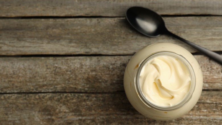 Jar of mayonnaise on table 