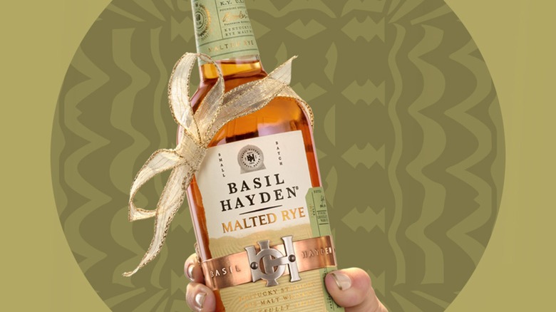 Hand holding Basil Hayden's Malted Rye