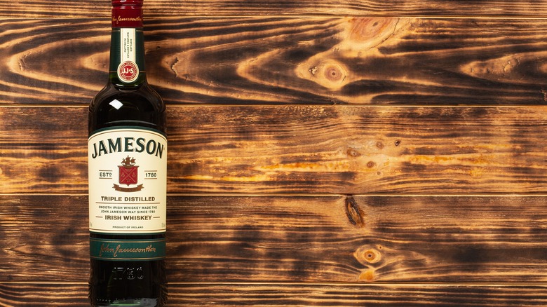 Bottle of Jameson on a wooden background