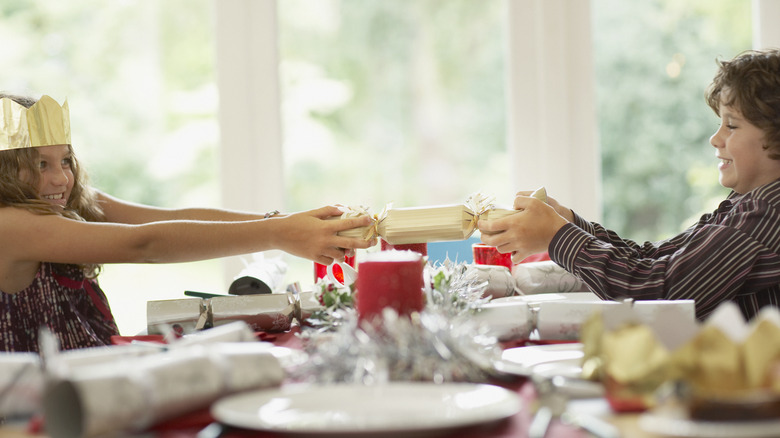 two guests pulling a Christmas cracker