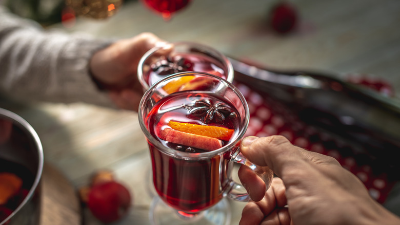 glasses with red wine and orange