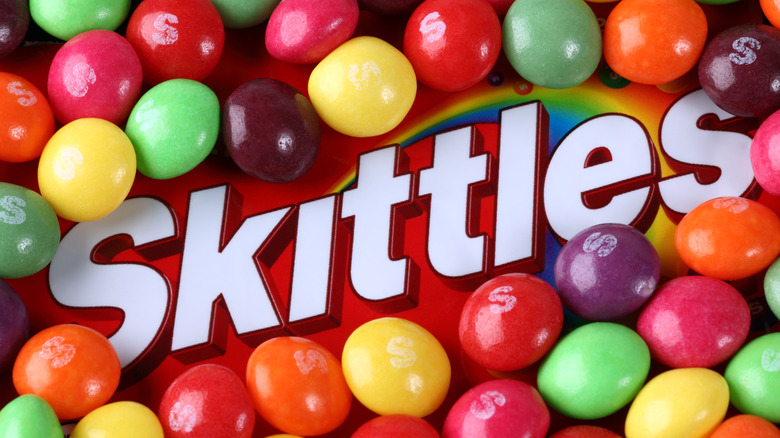 Multicolored candies on Skittles logo