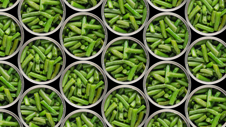 Open cans of green beans