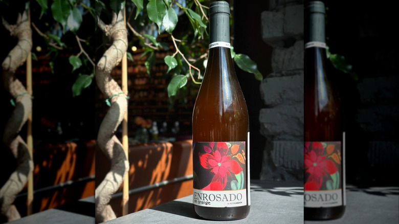 bottle of orange wine with floral label