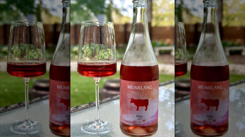 bottle and glass of sparkling rosé wine