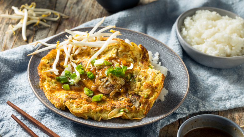 Egg foo young omelet with gravy and rice