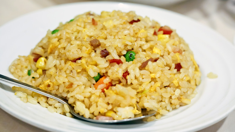 Molded golden fried rice with a spoon