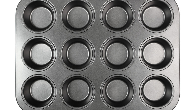 Muffin and cupcake pan on white background