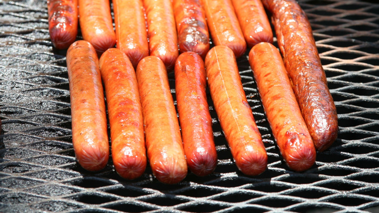 hot dogs on a grill