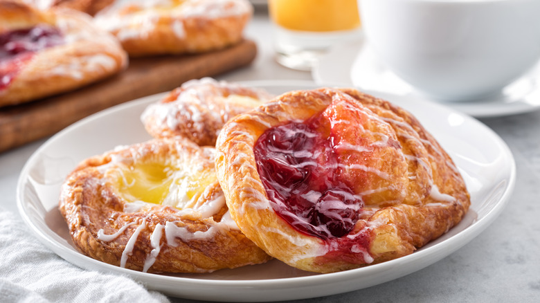 cherry and lemon mini Danishes on a marble table top