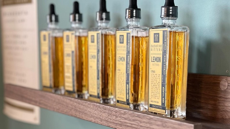 A row of Dashfire lemon bitters bottles on a shelf