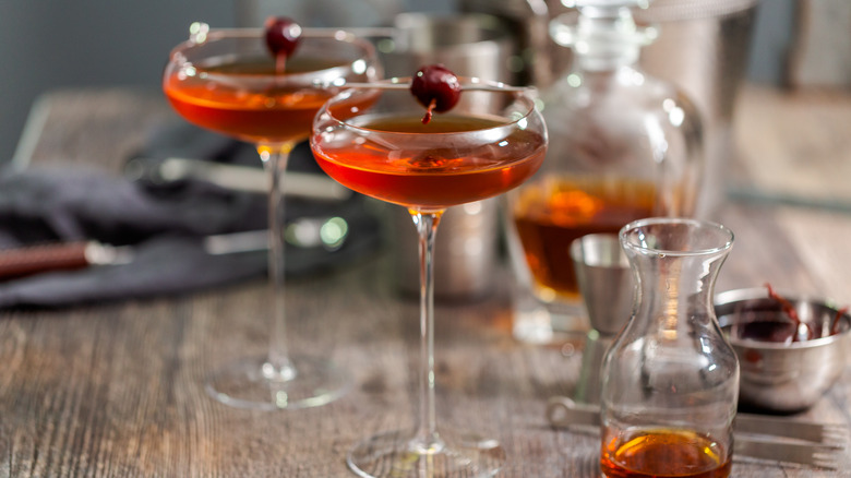 two Manhattan cocktails with cherry garnishes