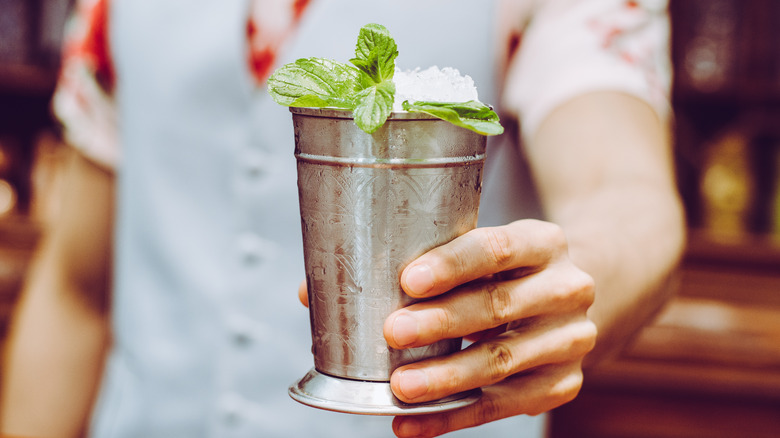 a mint julep with mint sprigs