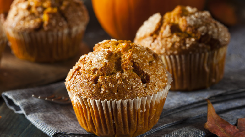 pumpkin muffins on tea towel