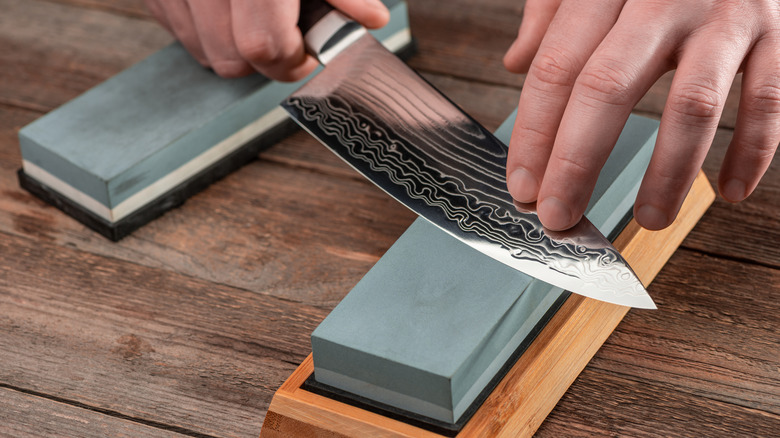 Sharpening knife on a whetstone