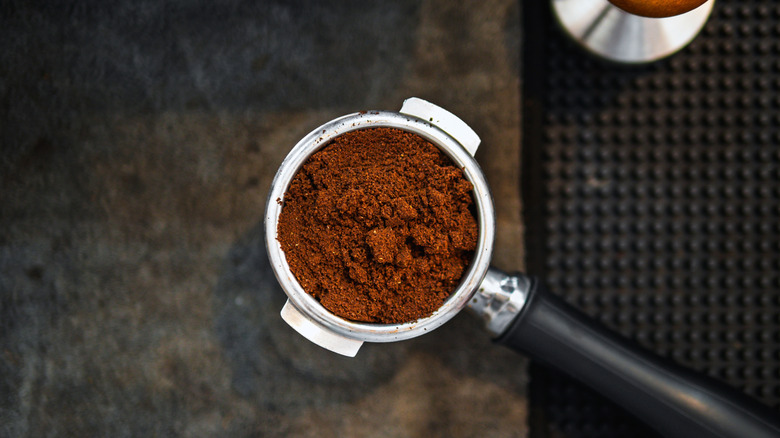 Top view of coffee grounds in a portable filter