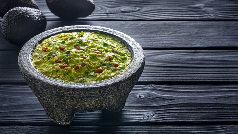 stone bowl with fresh guacamole