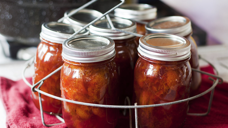 Sweet plum jam in mason jars