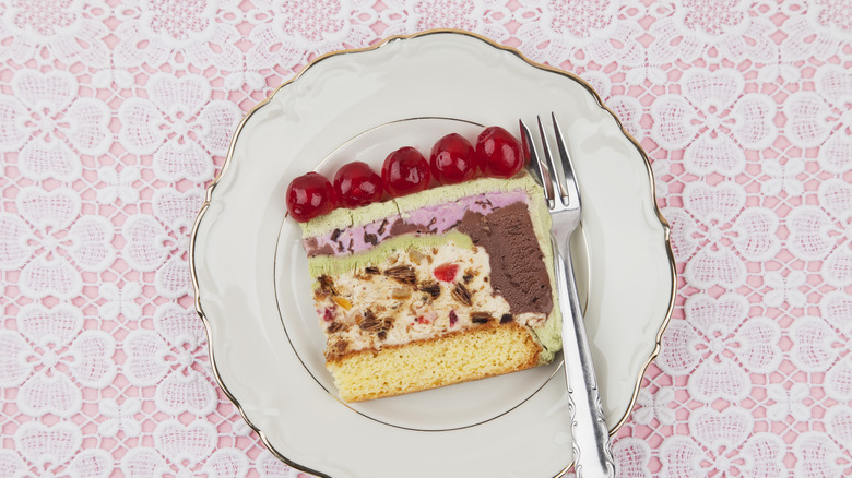 plated ice cream cake against doily tablecloth