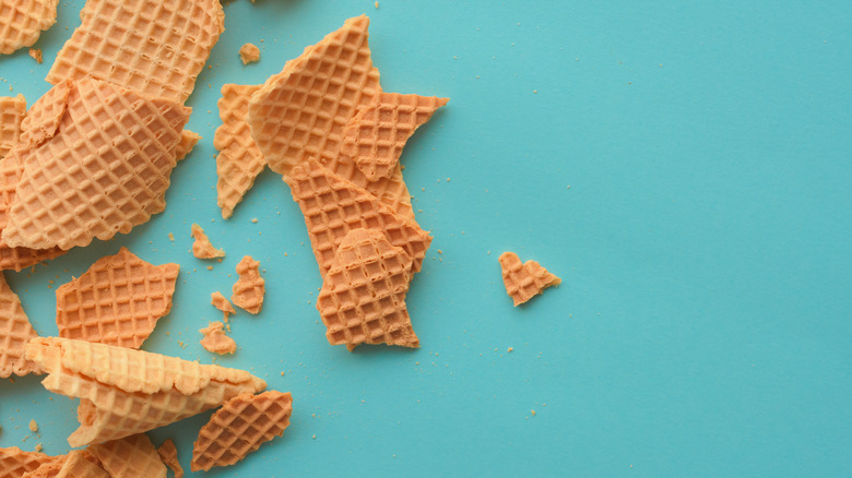 Waffle cone pieces against blue background