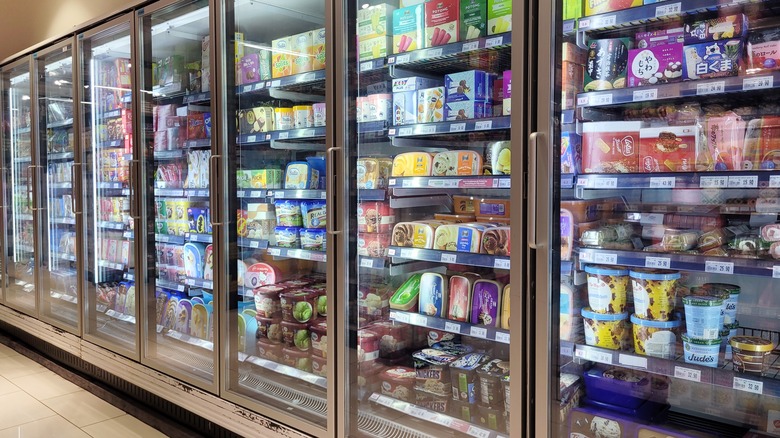 Ice creams in grocery store freezer aisle