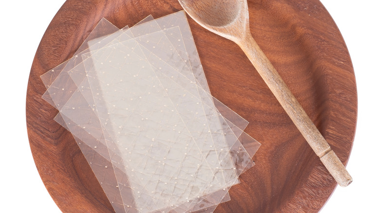 Unflavored gelatin sheets in a wooden bowl