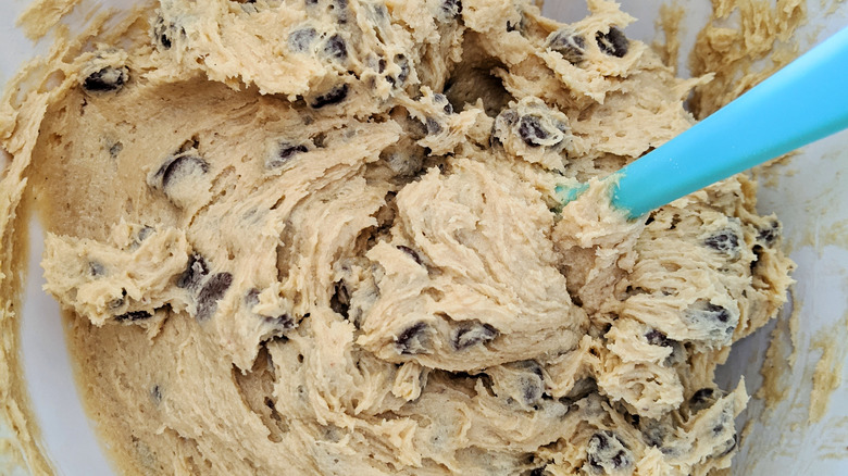 stirring cookie dough in bowl