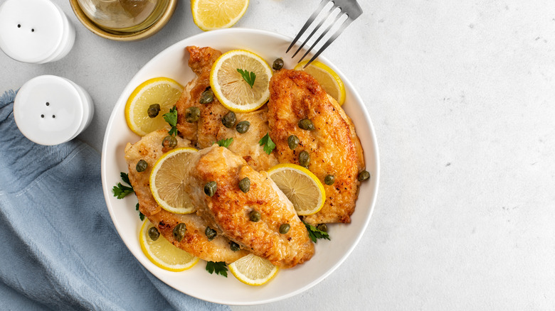 chicken piccata on white table