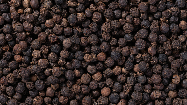 Whole black peppercorns