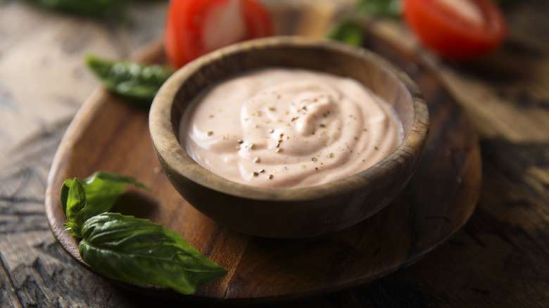 Traditional homemade mayo sauce with chiles on wooden serveware