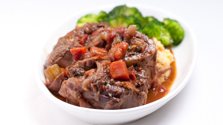 A dish of homemade osso buco veal shank braised with fresh tomato and aromatics