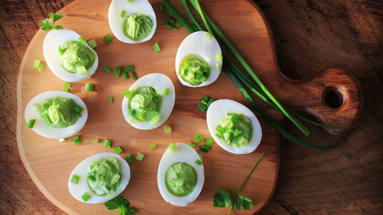 Avocado deviled eggs on board