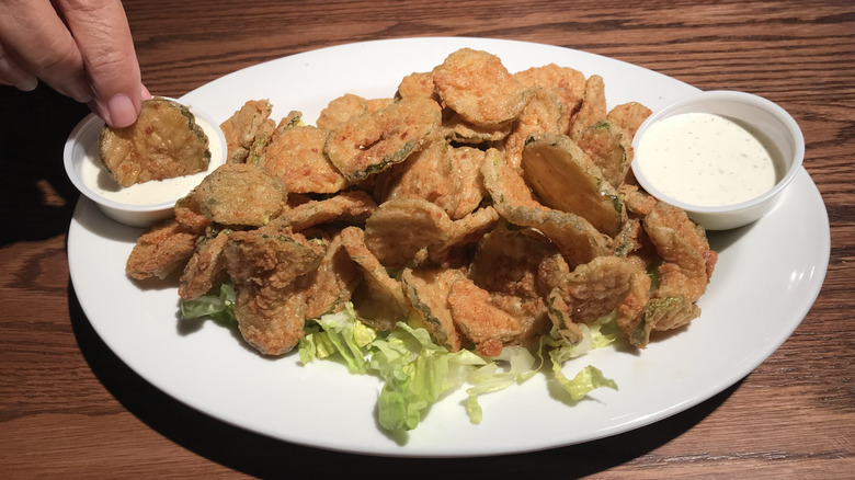 Plate of fried pickles with ranch dressing