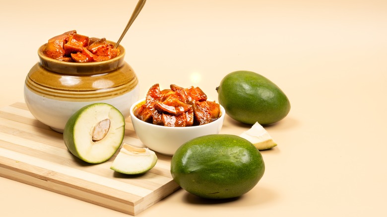 Jar and bowl of Indian green mango pickles